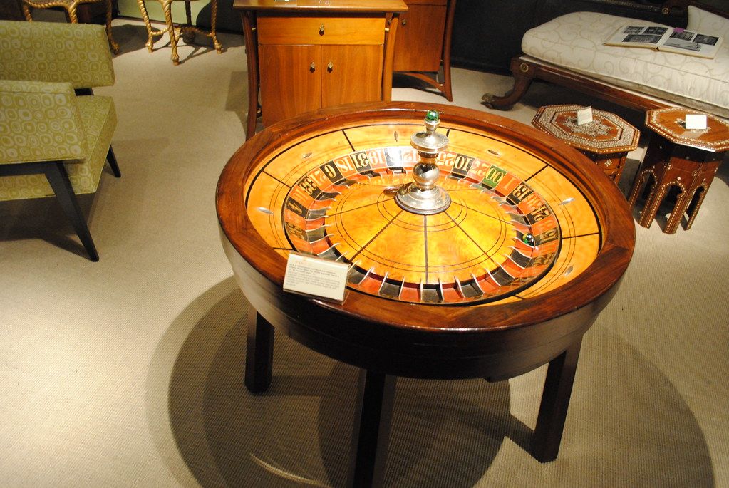 An antique roulette table at an antiques show