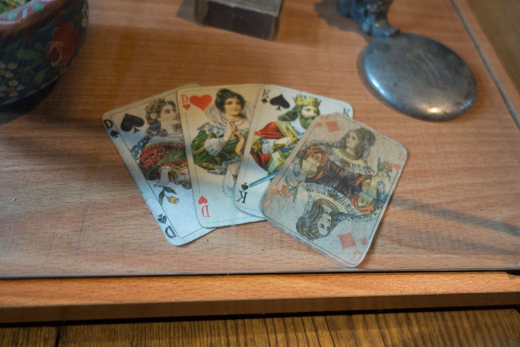 Antique playing cards on a wooden table