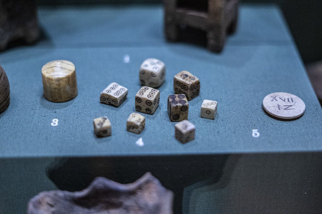 Ancient dice in a museum case